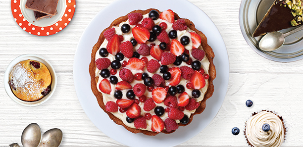 Cake topped with cream and berries