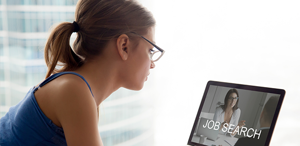 female job searching on laptop