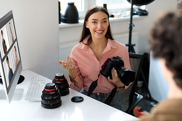 Photographer showing client photos