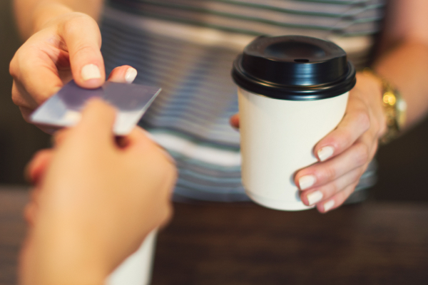 person paying for coffee