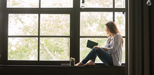 TAFE-Gippsland-Lady-reading-book-in-window