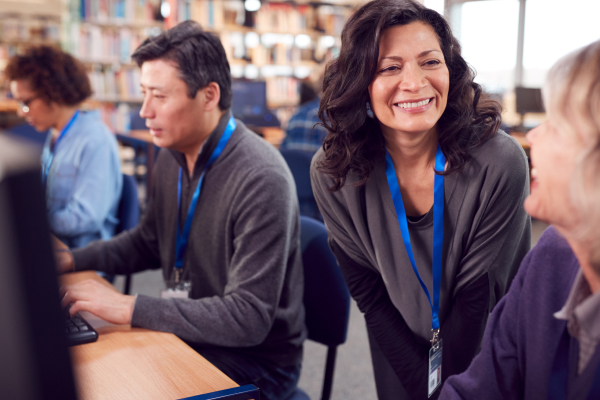 teacher talking to mature age students