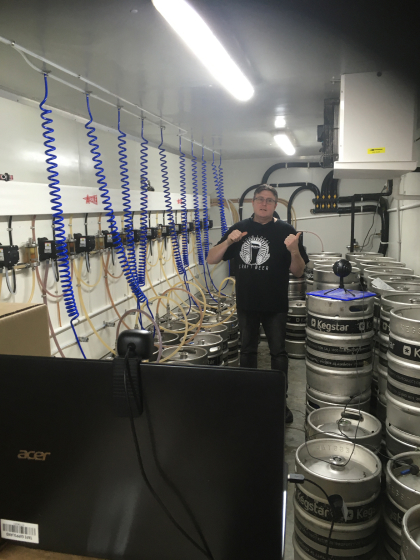 Phill showing off the unbeerlievable beer keg storage cool room.