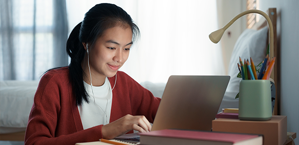 female student using using laptop