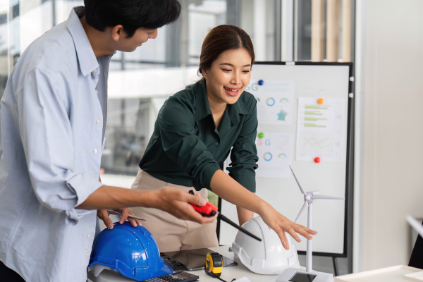 renewable engineers discussing wind farm