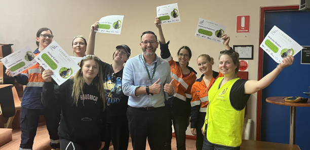 TAFE Gippsland CEO James Montgomery celebrates with graduating PHP students