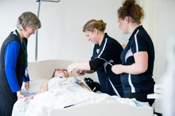 nursing students attending patient