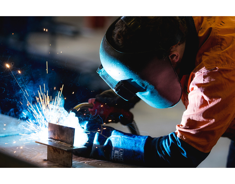 Cinematic photo of person welding