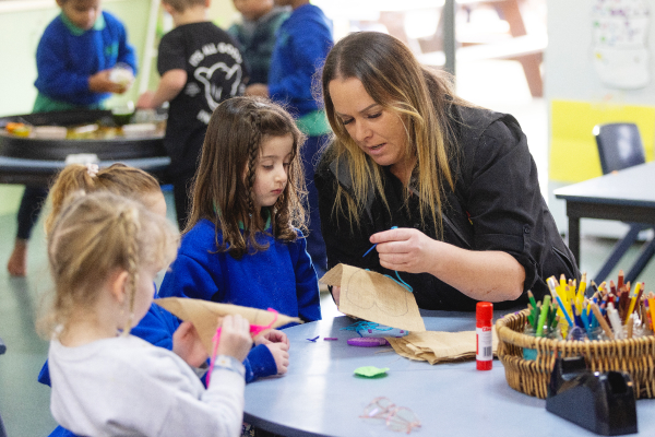 Early childhood teacher with students