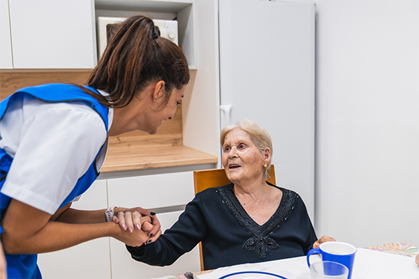 Nurse helping elderly patient