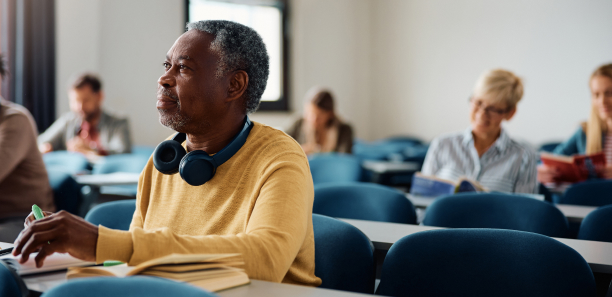 mature age students taking notes in class