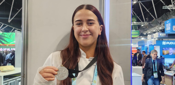 Jess Fraser holding up her silver medal at the AUS TAFE National Finals 