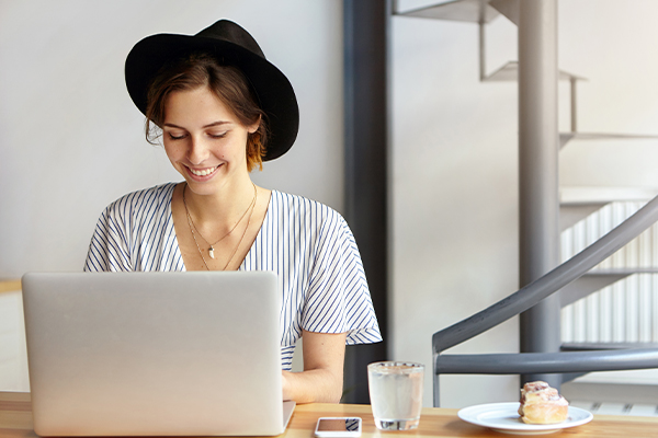 Woman typing on laptop