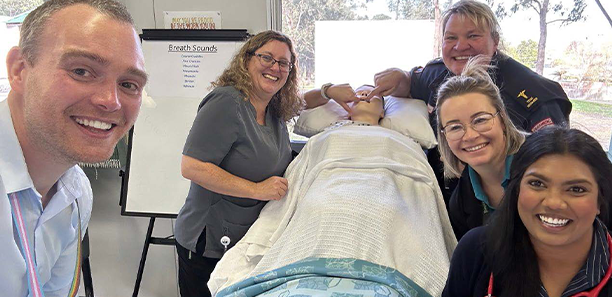 Students surround new nursing mannikin