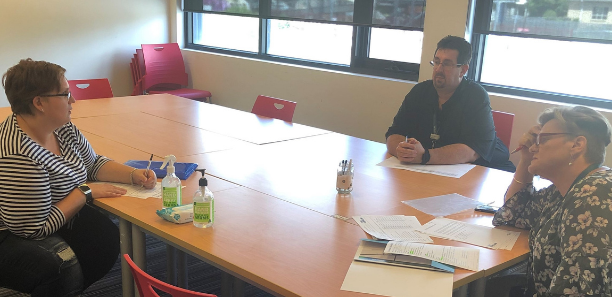 Jamie is pictured (middle) during an enrolment session in Morwell as another Community Services student begins her learning journey