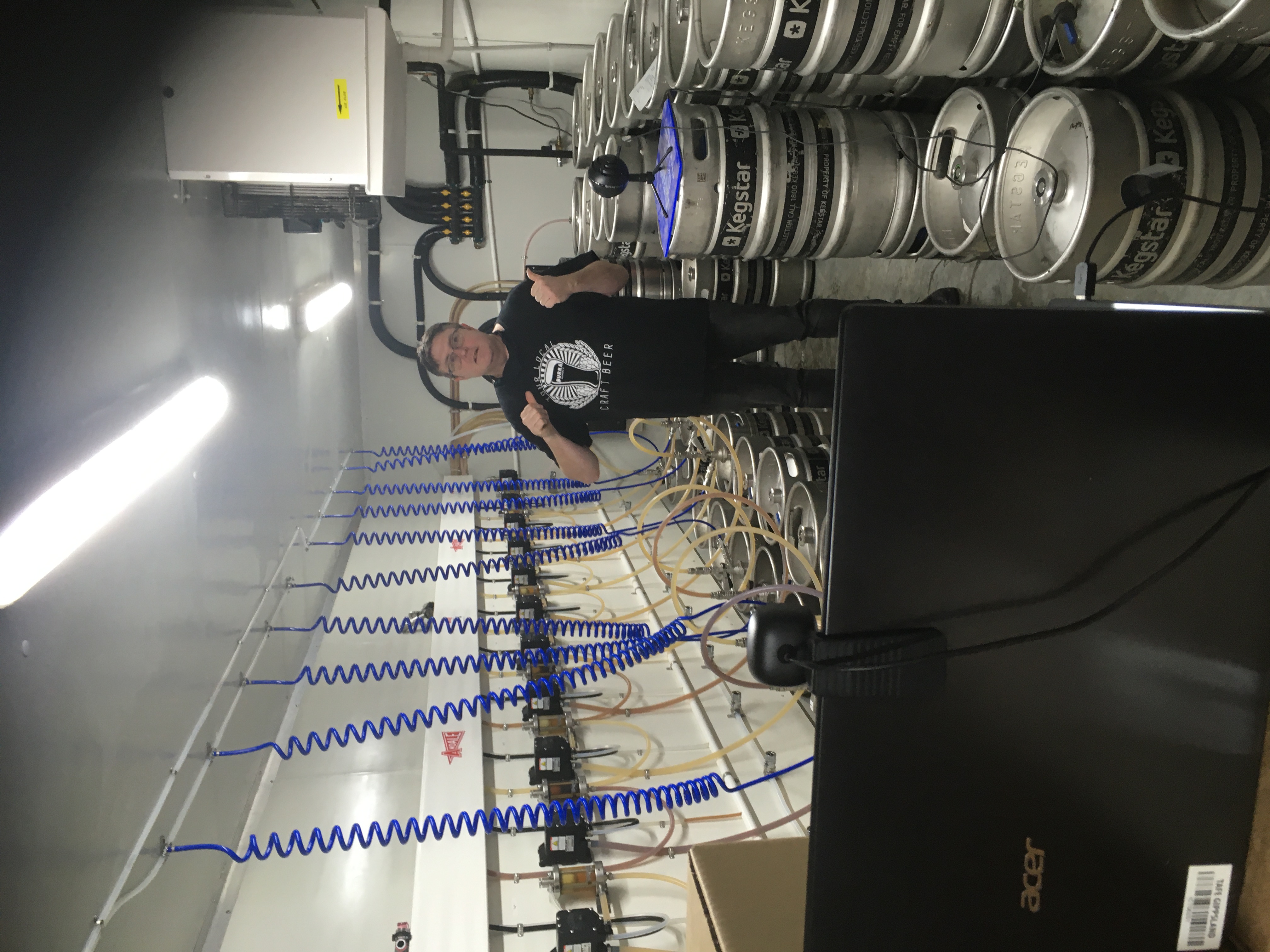 Phill showing off the unbeerlievable beer keg storage cool room. 