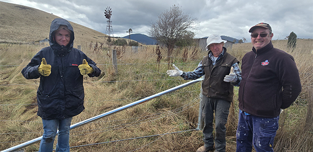 Fencing project participants at work