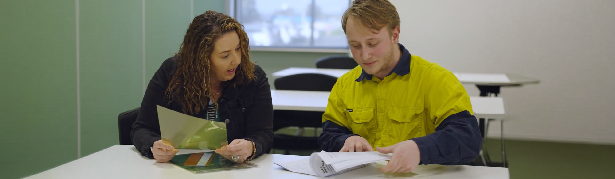 Support officer heling trade student with study